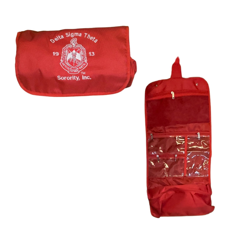 Red Delta Sigma Theta toiletry bag front view with embroidered crest
Delta Sigma Theta toiletry bag interior pockets, hanging hook detail